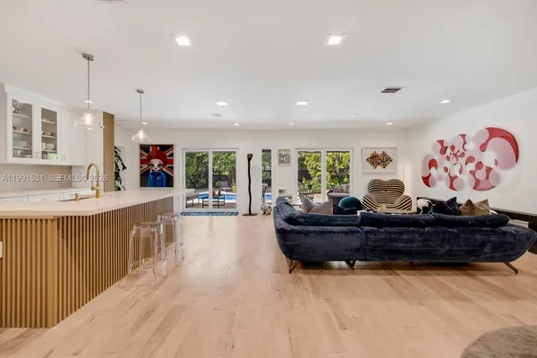 a living room with furniture and a large window