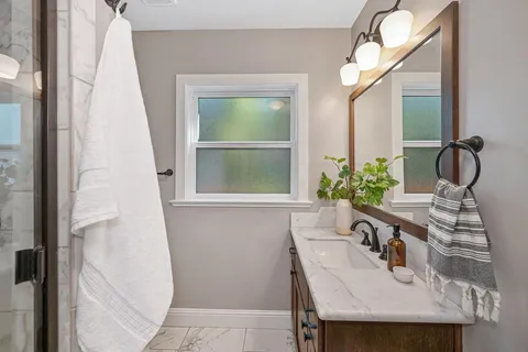 a bathroom with a sink and a mirror