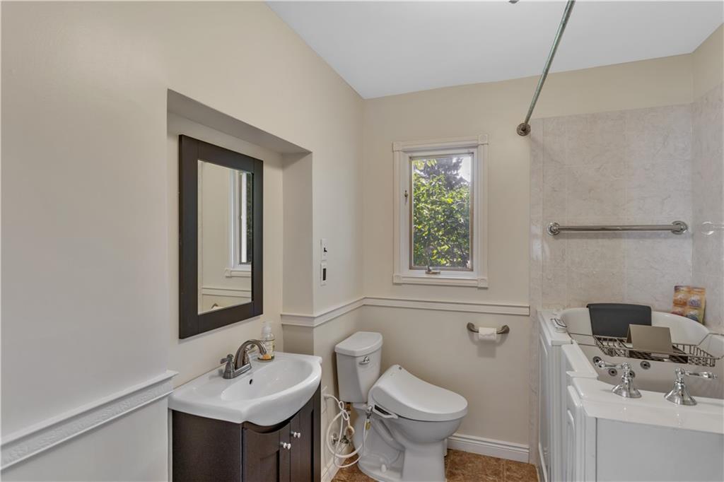 2753 Rochester Road Cranberry Township, PA 16066 - Photo 15 of 38 a bathroom with a sink toilet and mirror
