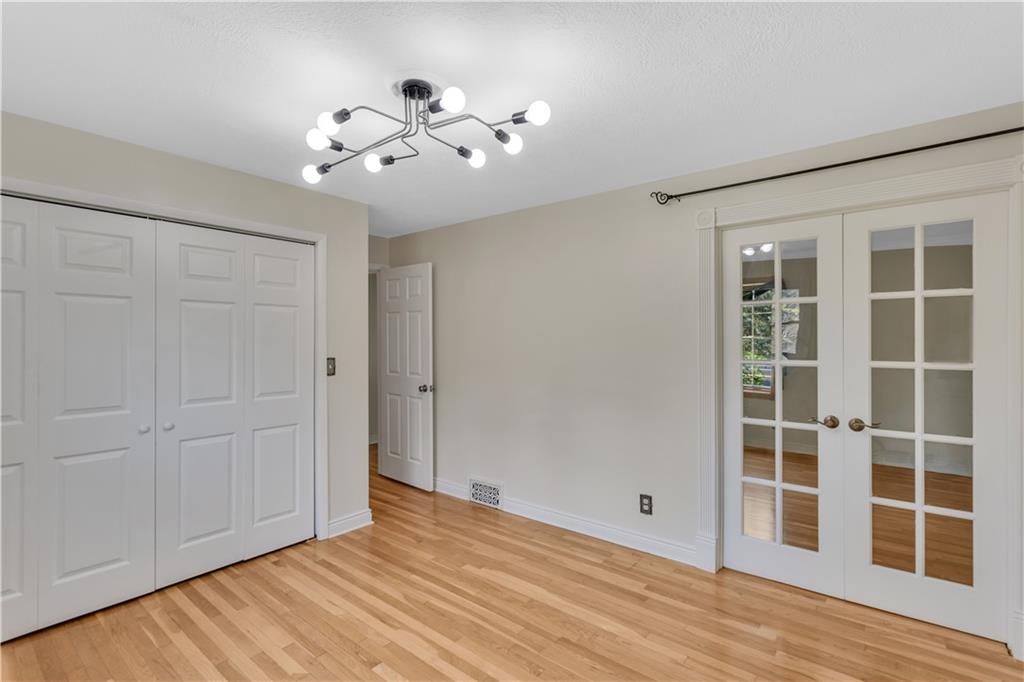 2753 Rochester Road Cranberry Township, PA 16066 - Photo 16 of 38 a view of empty room with wooden floor and fan