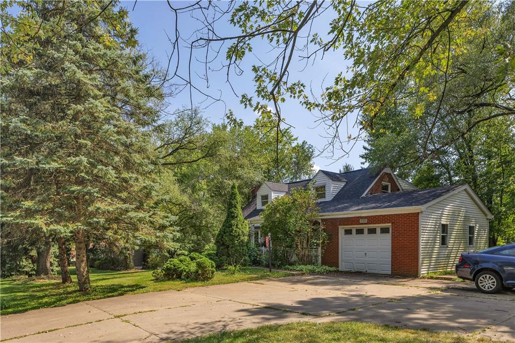 2753 Rochester Road Cranberry Township, PA 16066 - Photo 2 of 38 a front view of a house with a garden