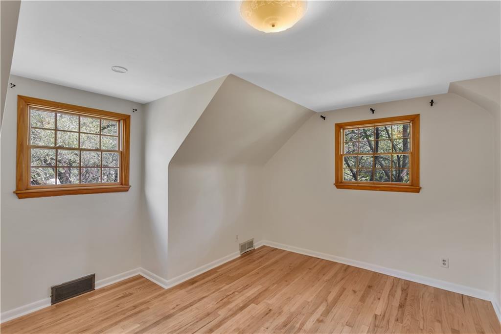 2753 Rochester Road Cranberry Township, PA 16066 - Photo 21 of 38 a view of an empty room with wooden floor and a window