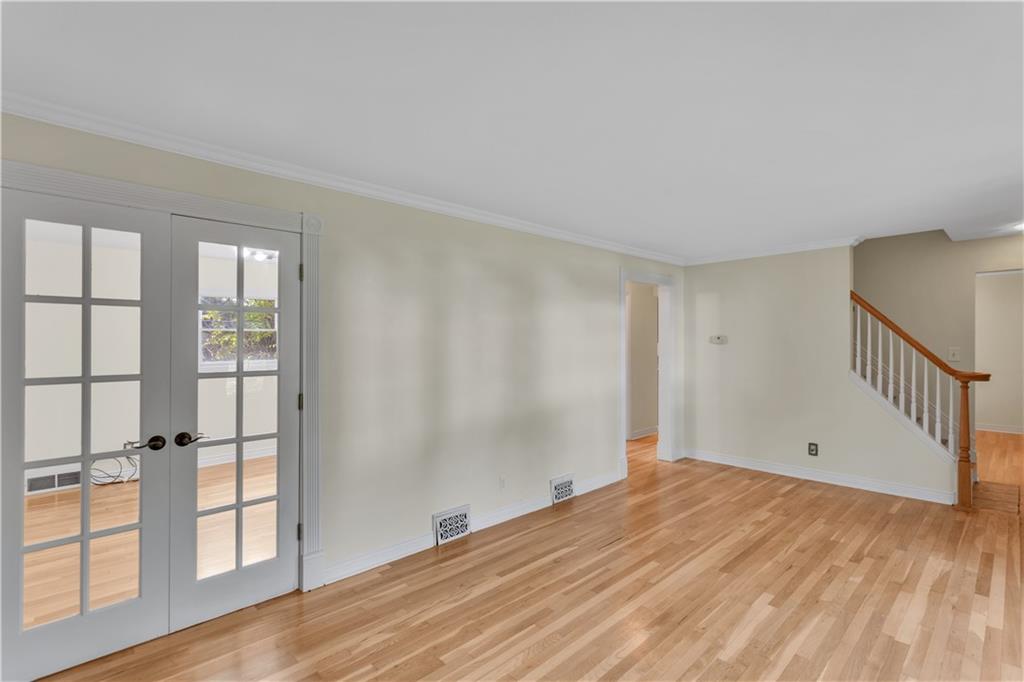 2753 Rochester Road Cranberry Township, PA 16066 - Photo 8 of 38 wooden floor in an empty room with a window