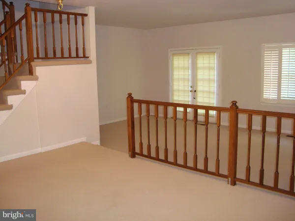 a view of a porch with wooden floor