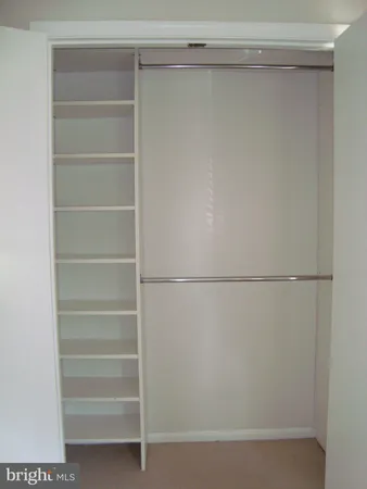 a view of a small space with wooden floor