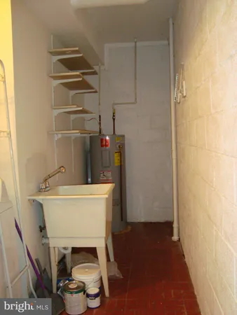 a view of a storage & utility room with two windows