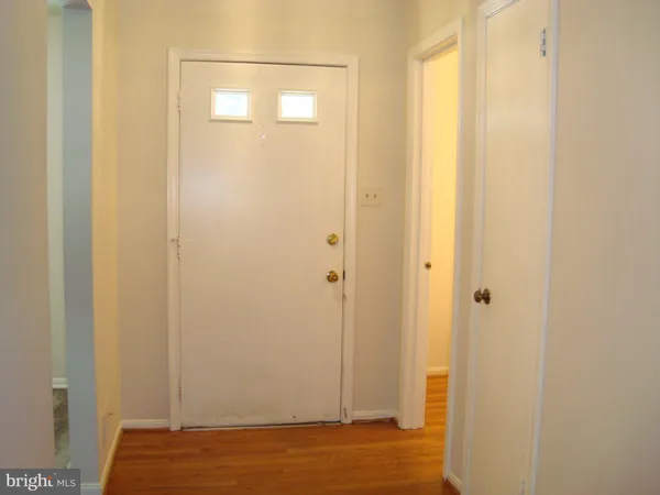 a view of a bathroom with wooden floor