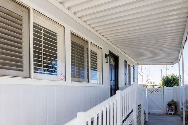 a view of house with swimming pool and garden