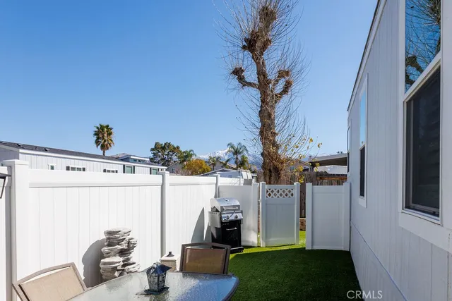 a patio with table and chairs