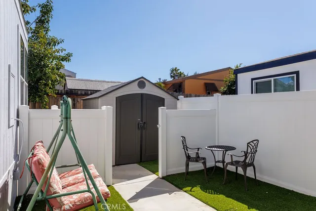 a view of roof deck with wooden floor and outdoor seating