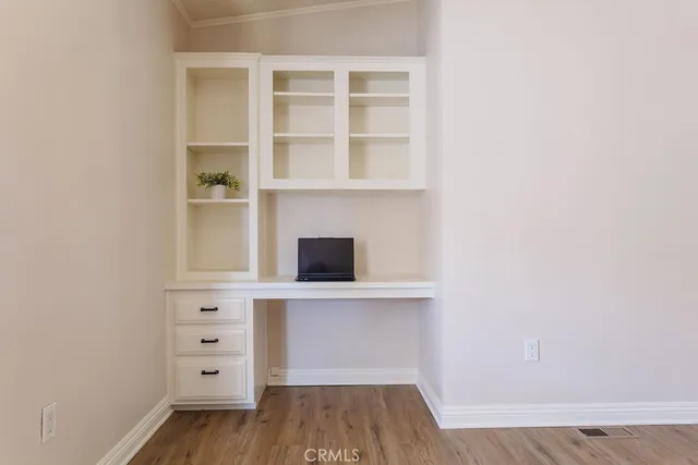 wooden floor in a white cabinet