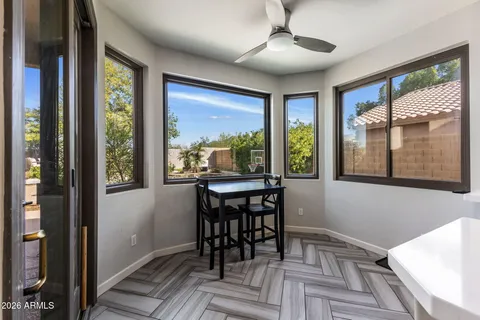 a view of a dining room with furniture window and outside view