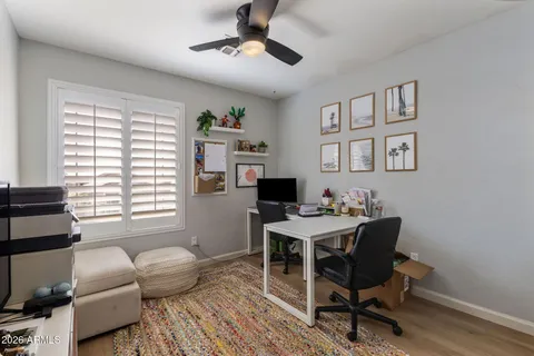 a view of a livingroom with workspace and a couch