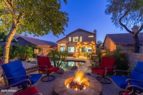 a view of a chairs and table in the patio