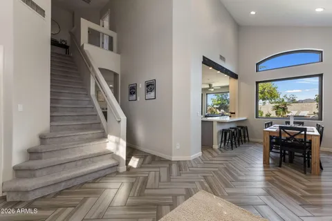 a view of entryway and hall with wooden floor