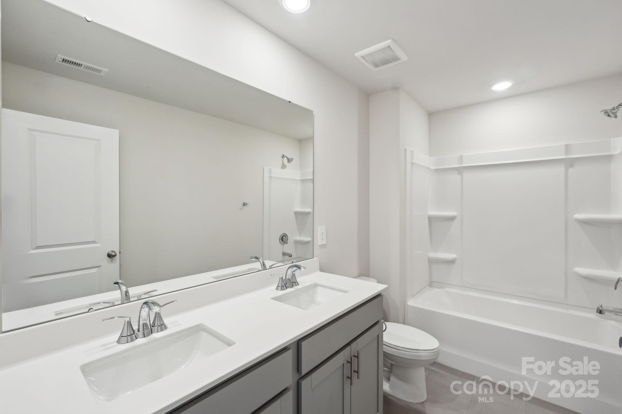 167 Murphy Mdw Road Mocksville, NC 27028 - Photo 19 of 21 a bathroom with a sink double vanity granite toilet tub and shower