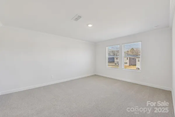 an empty room with a empty space and window