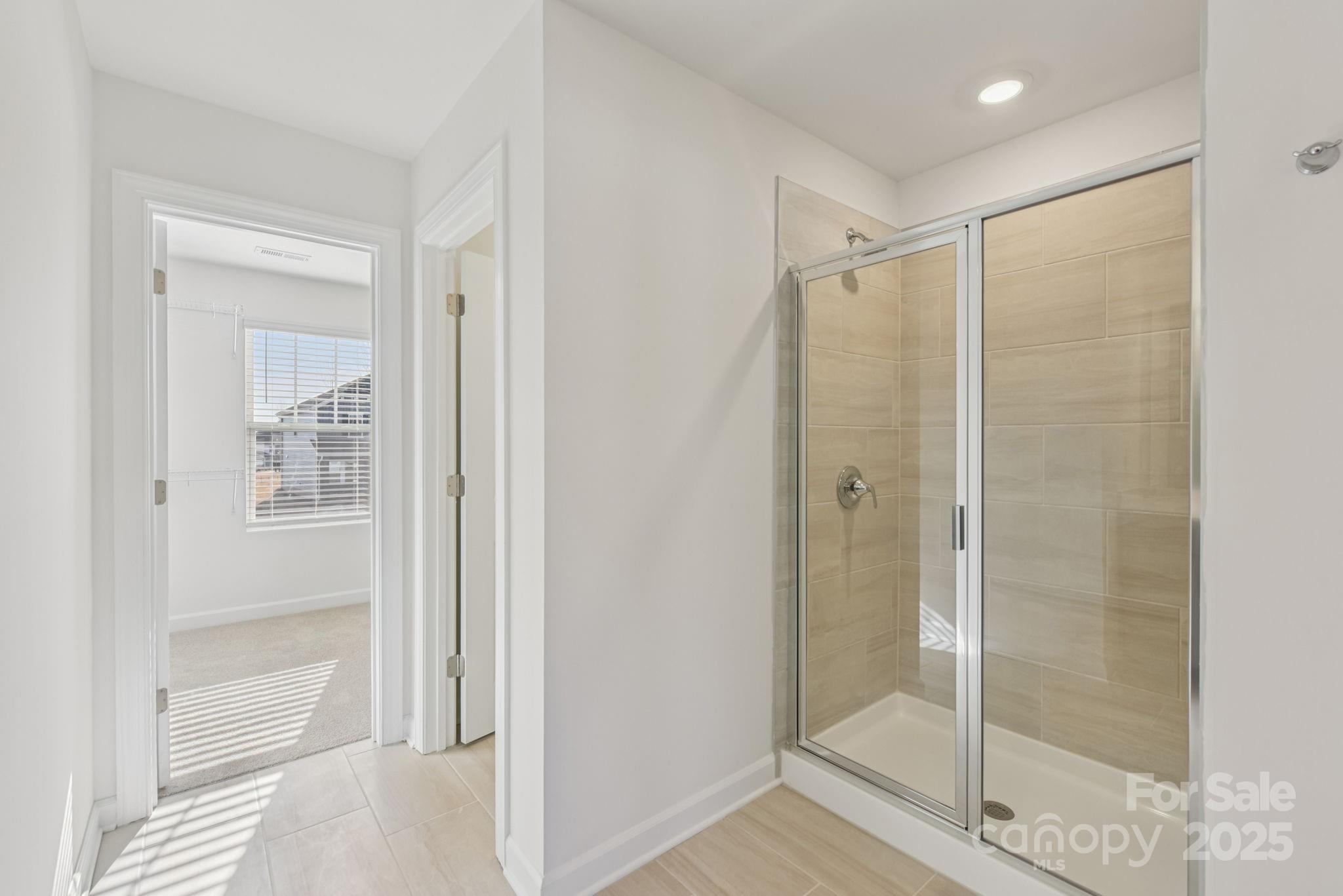 167 Murphy Mdw Road Mocksville, NC 27028 - Photo 22 of 28 a bathroom with a glass shower door