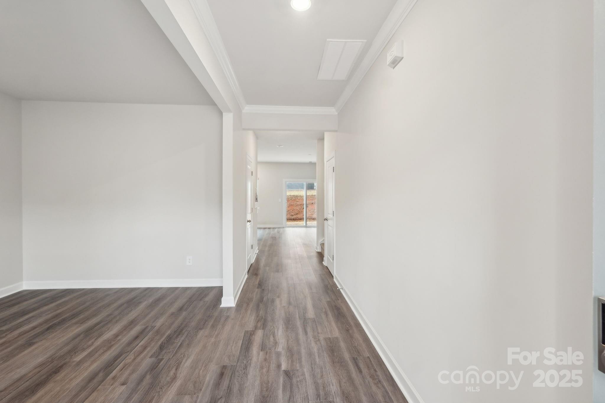167 Murphy Mdw Road Mocksville, NC 27028 - Photo 3 of 21 a view of a hallway with wooden floor