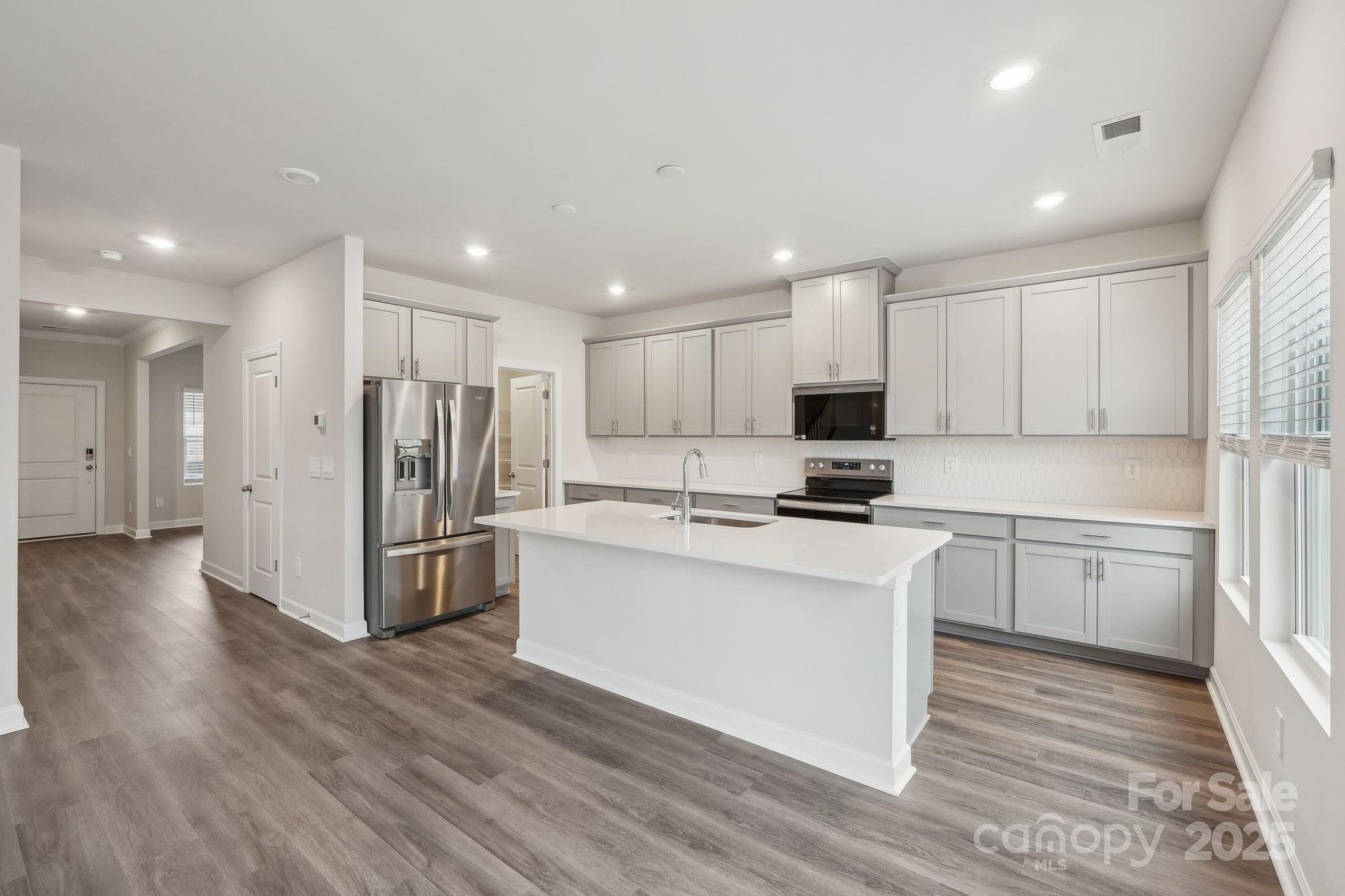 167 Murphy Mdw Road Mocksville, NC 27028 - Photo 5 of 21 a kitchen with stainless steel appliances a refrigerator stove microwave and cabinets