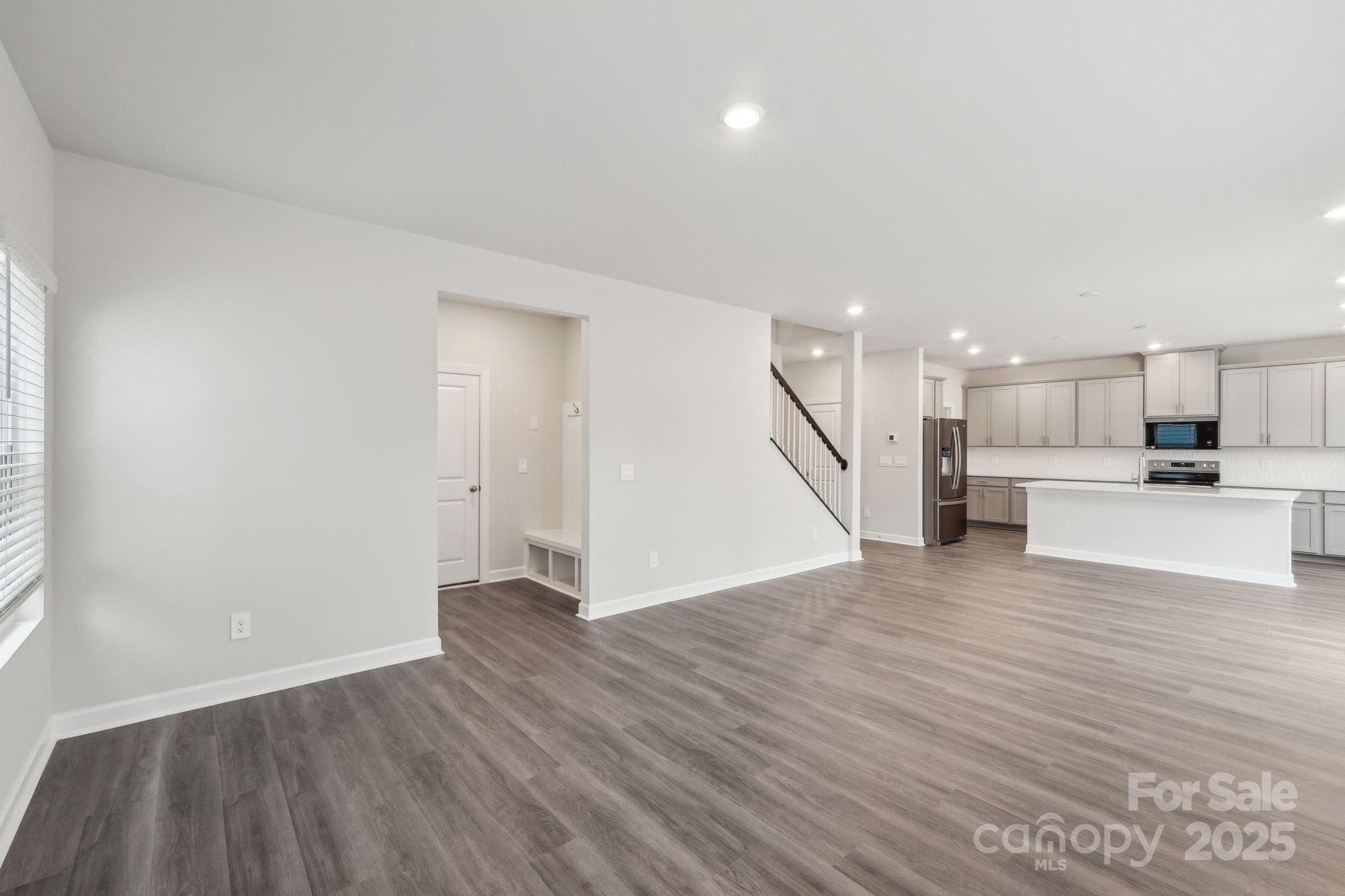167 Murphy Mdw Road Mocksville, NC 27028 - Photo 6 of 21 a view of kitchen and hall with wooden floor