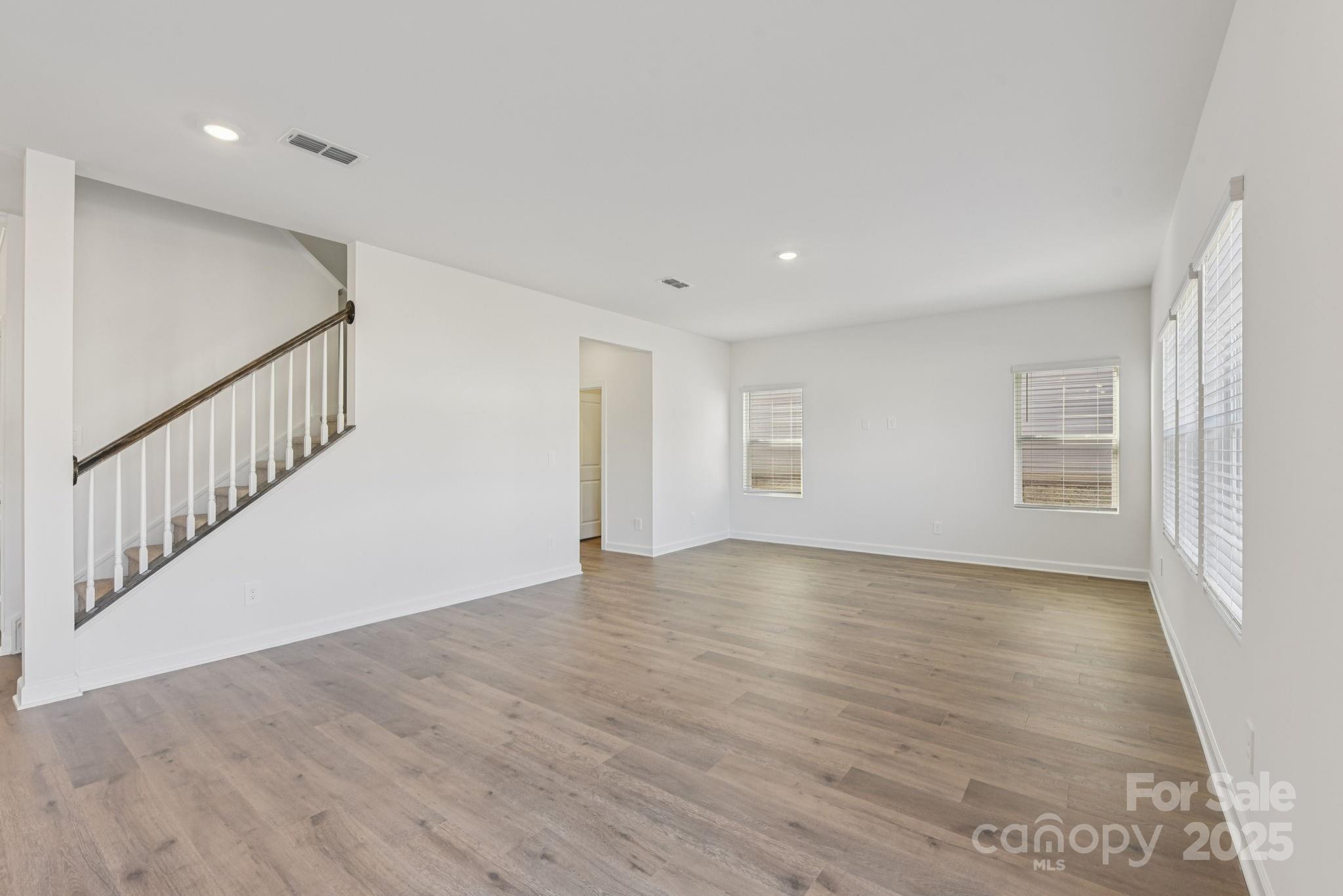 167 Murphy Mdw Road Mocksville, NC 27028 - Photo 7 of 28 a view of an empty room with wooden floor