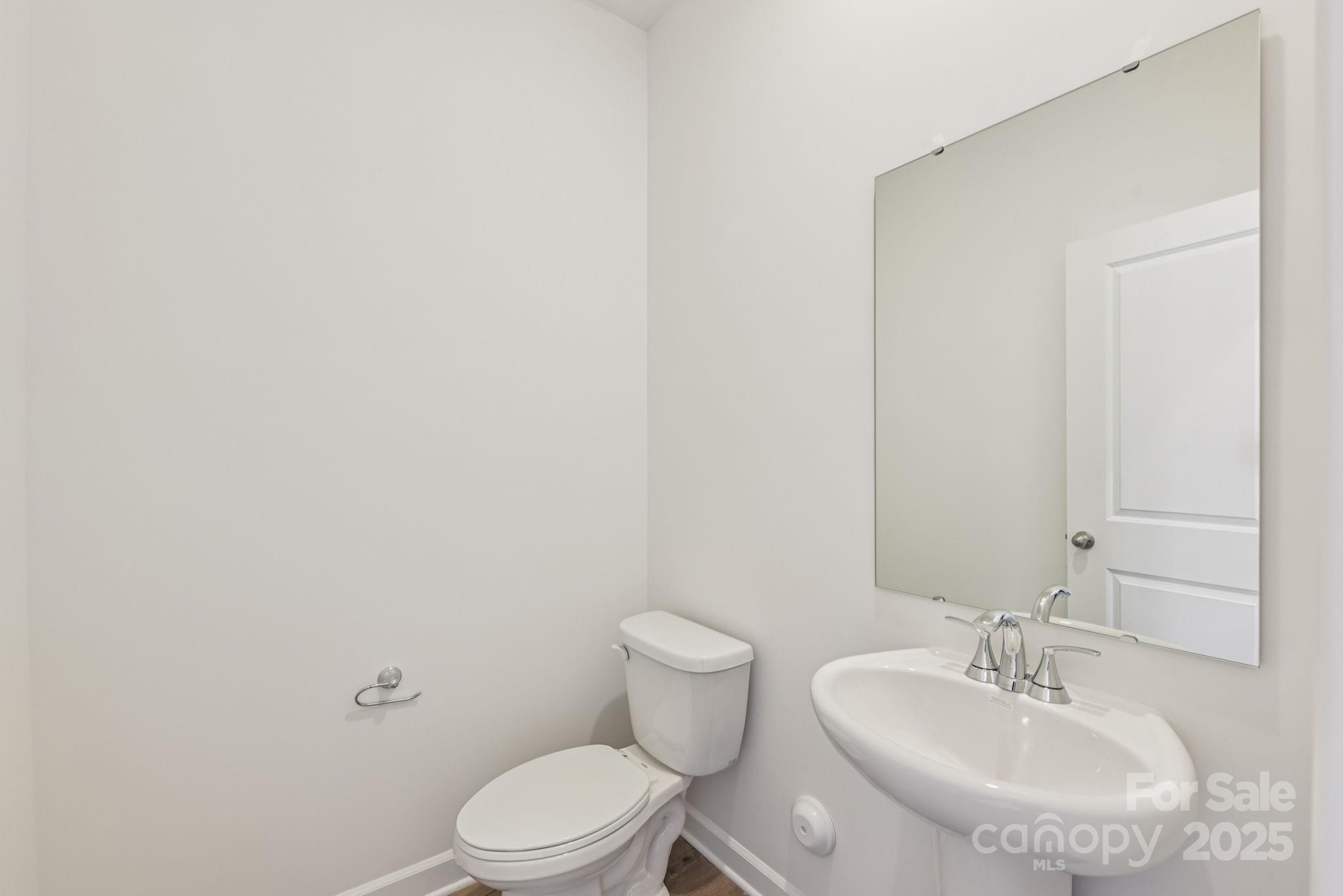 167 Murphy Mdw Road Mocksville, NC 27028 - Photo 10 of 28 a bathroom with a sink a toilet and mirror