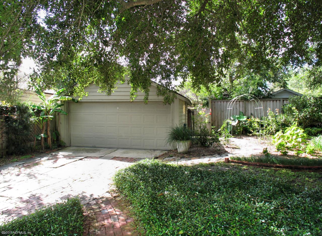 1604 Berwick Road Jacksonville, FL 32207 - Photo 13 of 13 a backyard of a house with plants and a tree