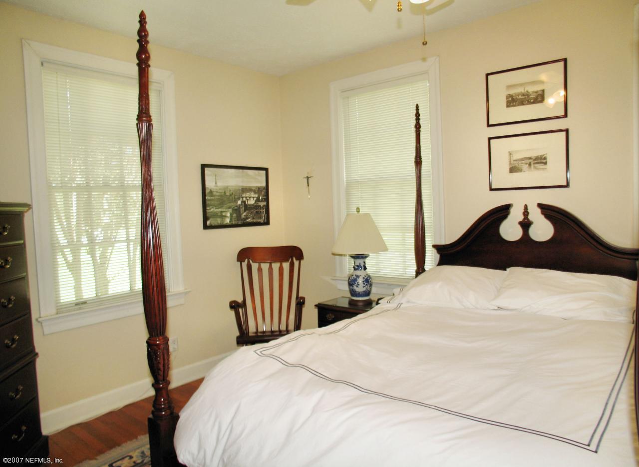 1604 Berwick Road Jacksonville, FL 32207 - Photo 6 of 13 a bedroom with a bed and a window