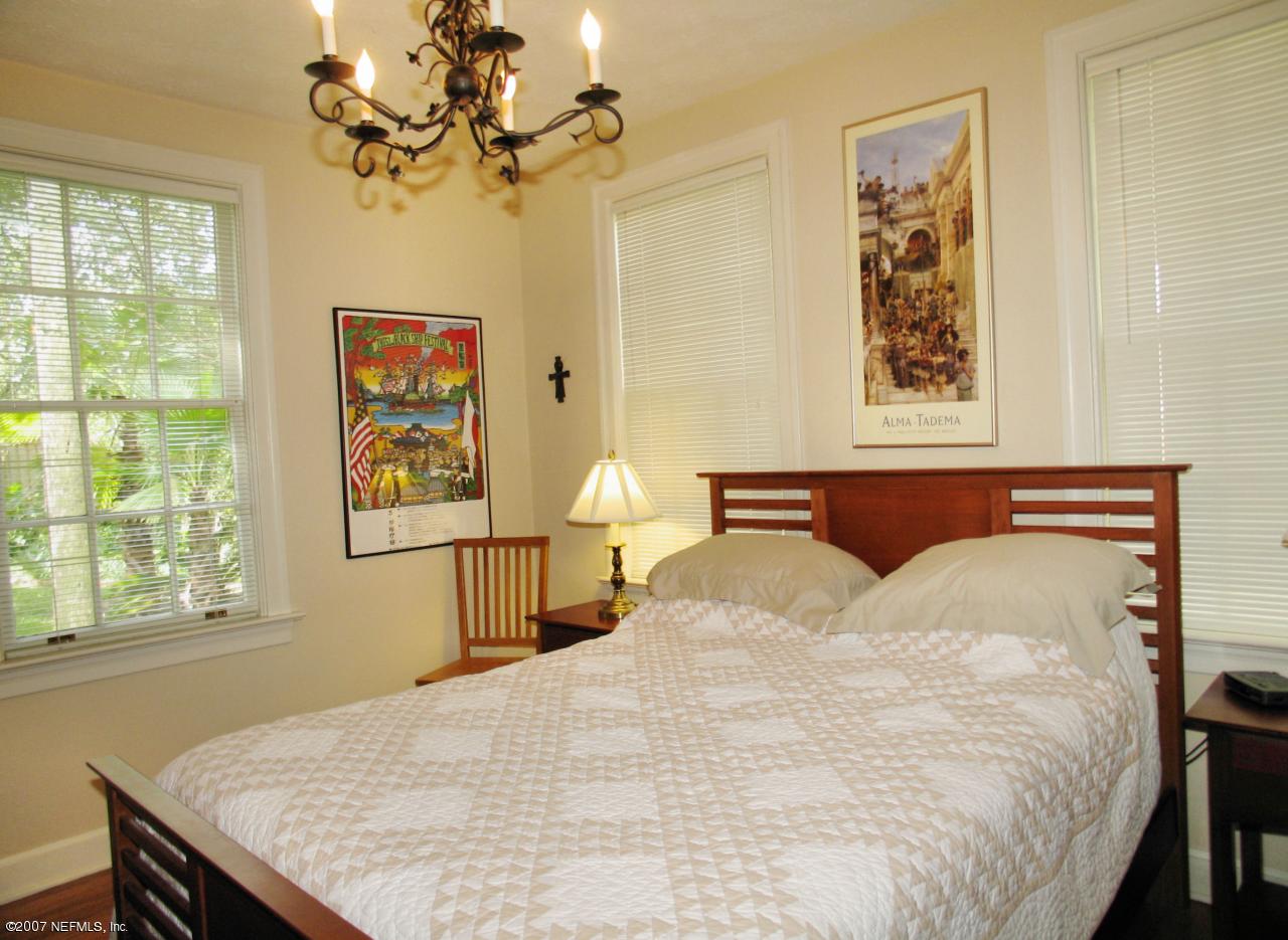 1604 Berwick Road Jacksonville, FL 32207 - Photo 8 of 13 a bedroom with a bed and a window
