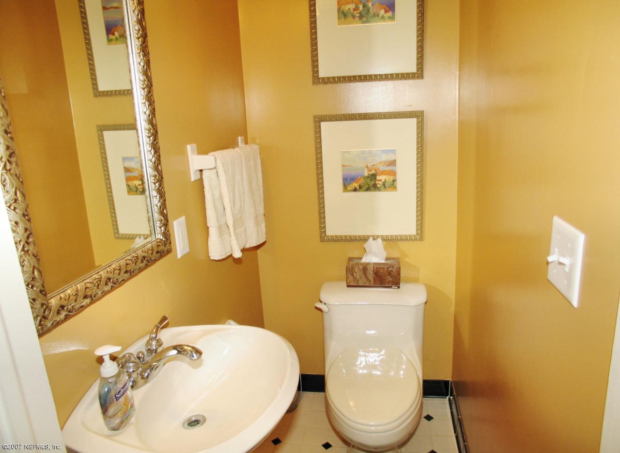 1604 Berwick Road Jacksonville, FL 32207 - Photo 9 of 13 a bathroom with a sink mirror and toilet