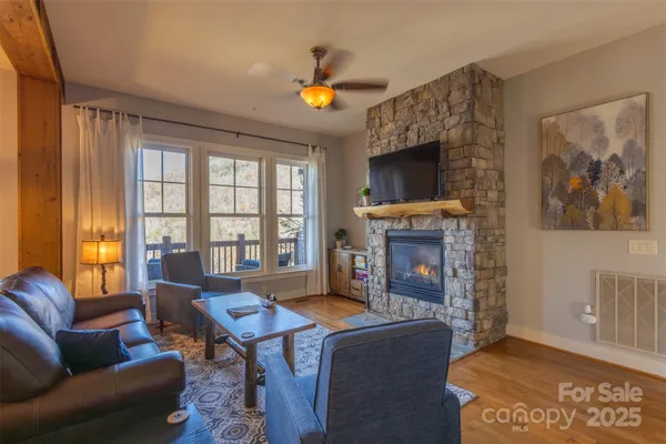 a living room with furniture and a fireplace