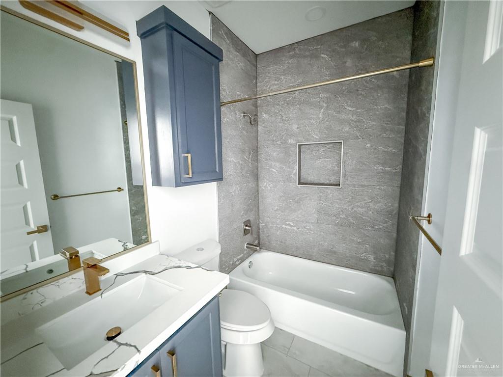 2104 Cassandra Street, Unit 3 Mission, TX 78572 - Photo 13 of 15 a bathroom with a sink toilet and shower