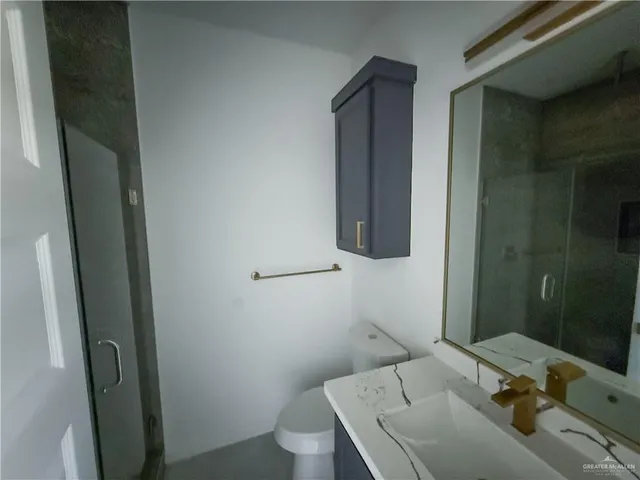 a bathroom with a sink and mirror