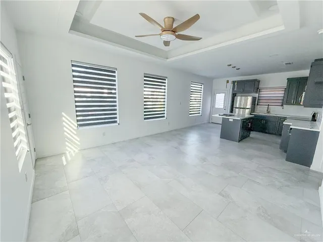 a view of a livingroom with furniture and windows