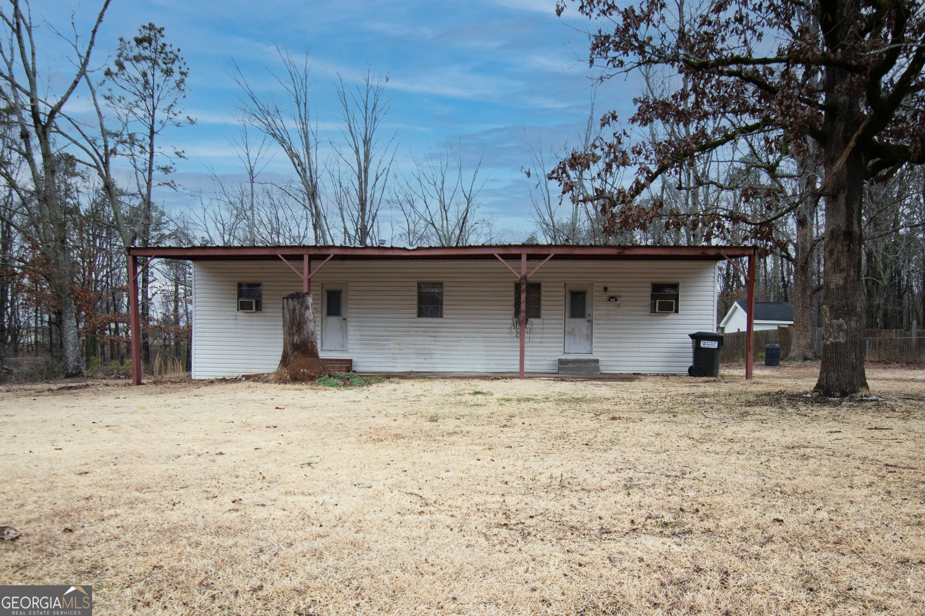 161 Eaves Road Bremen, GA 30110 - Photo 1 of 1 a house with trees in front of it