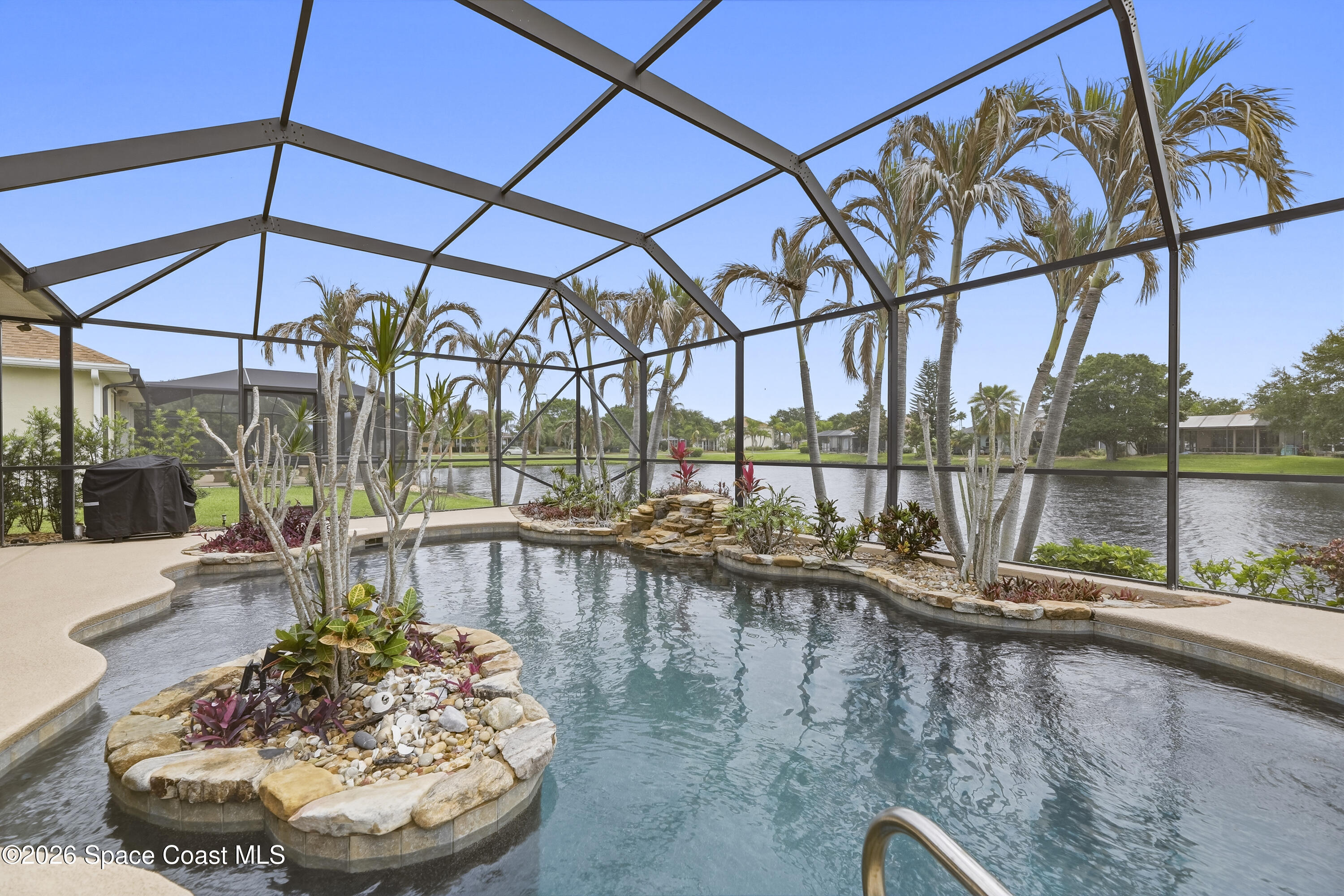 1643 Long Pine Road Melbourne, FL 32940 - Photo 50 of 63 a view of a swimming pool with a patio