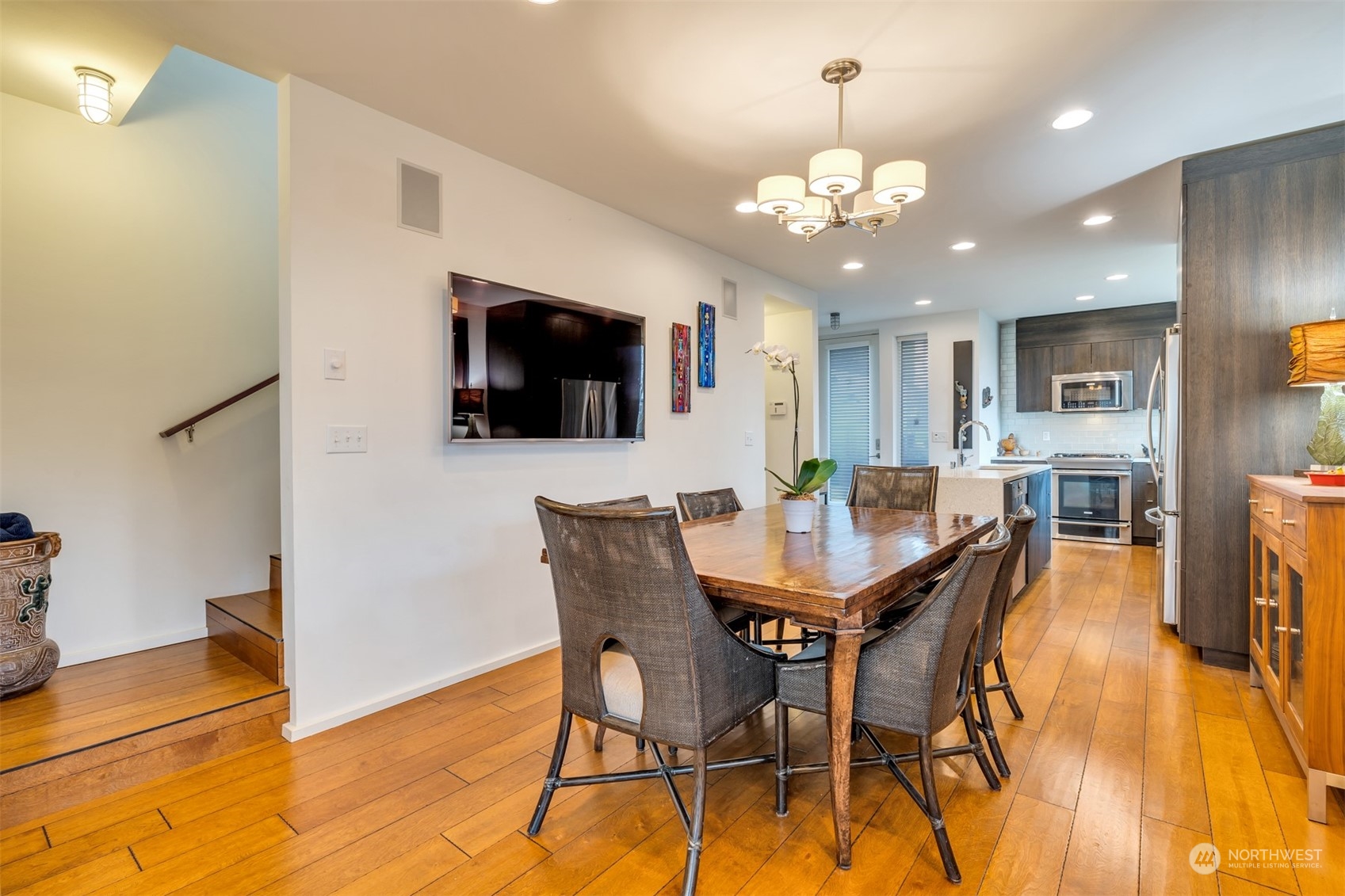 4457 Renton Avenue South Seattle, WA 98108 - Photo 10 of 40 a view of a dining room with furniture and a flat screen tv