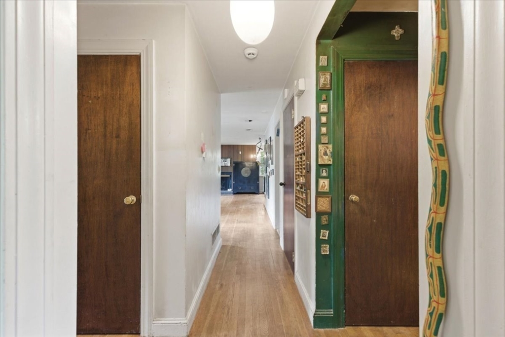 99 Brook Road Sharon, MA 02067 - Photo 15 of 37 a view of a hallway with wooden floor
