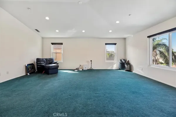 a view of walk in closet with clothes