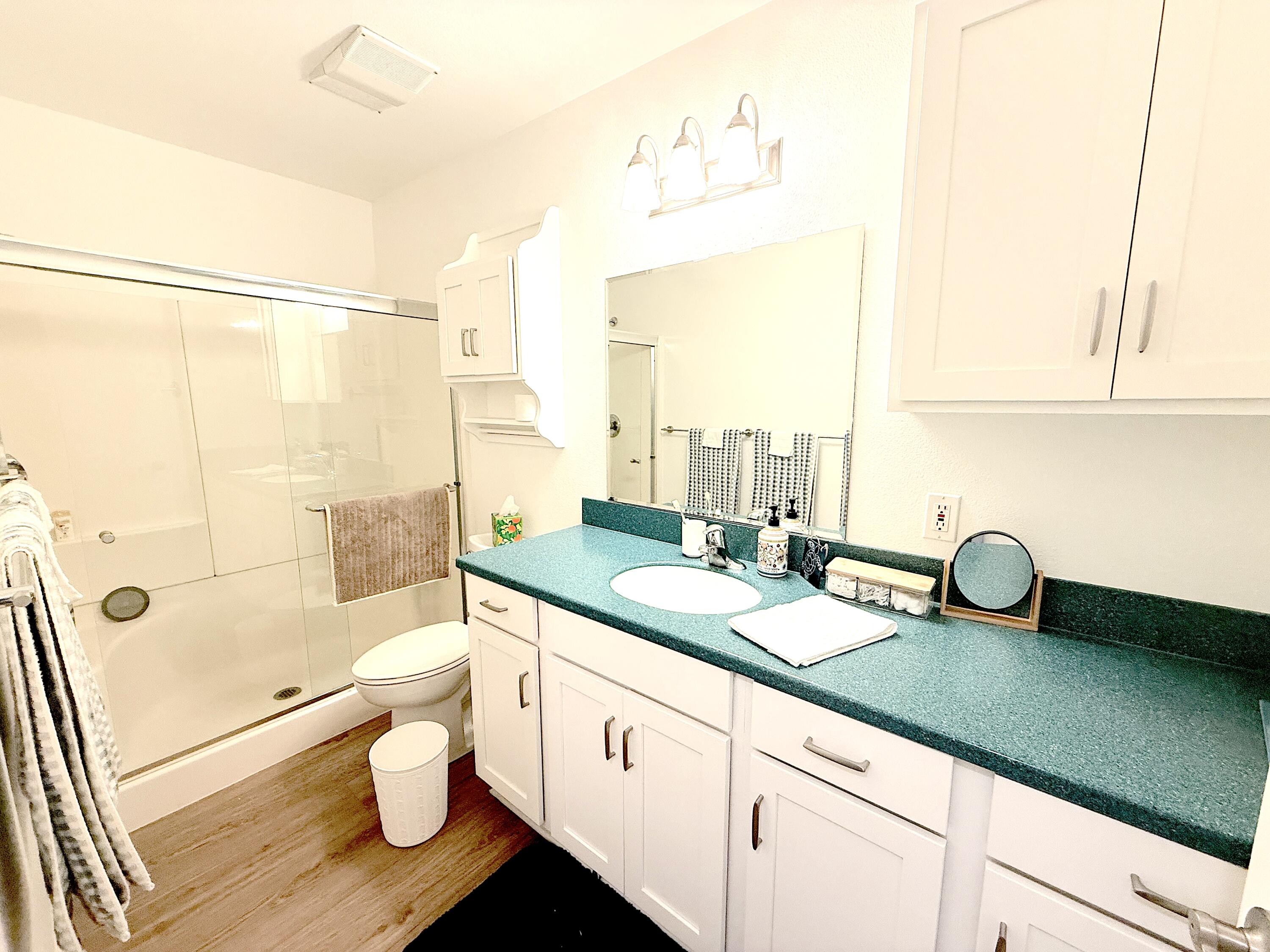 29 Dearborn Place, Unit 10 Goleta, CA 93117 - Photo 6 of 7 a bathroom with a granite countertop sink mirror vanity and toilet