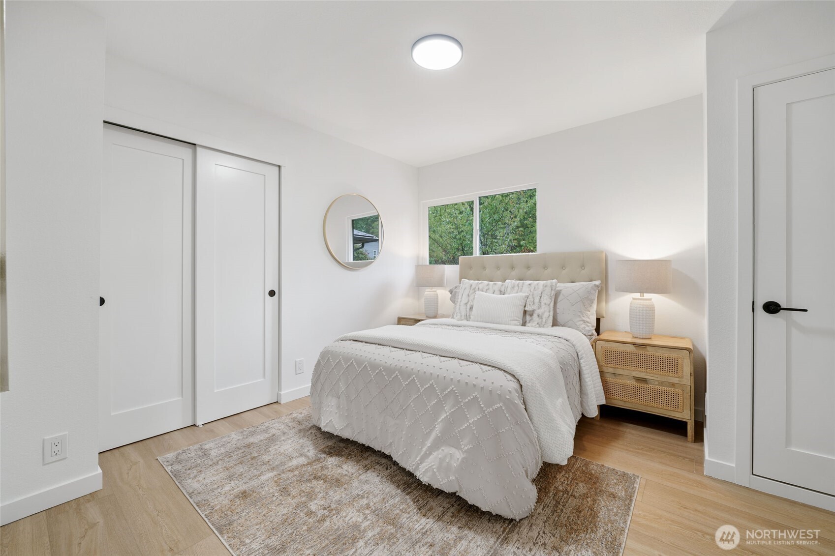 7004 16th Avenue Southwest Seattle, WA 98106 - Photo 17 of 37 a bedroom with a bed and a window