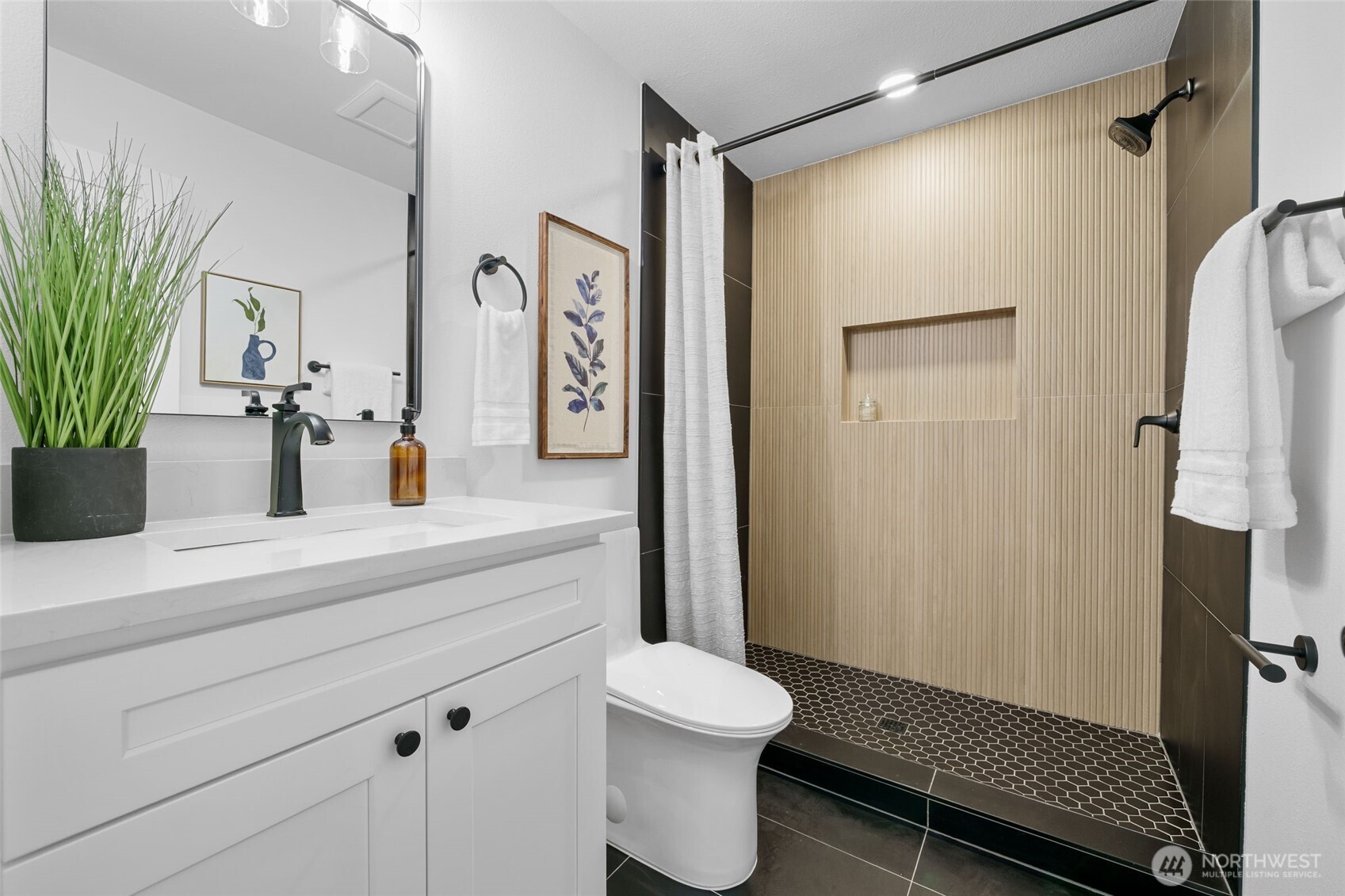 7004 16th Avenue Southwest Seattle, WA 98106 - Photo 19 of 37 a bathroom with a sink a toilet and shower