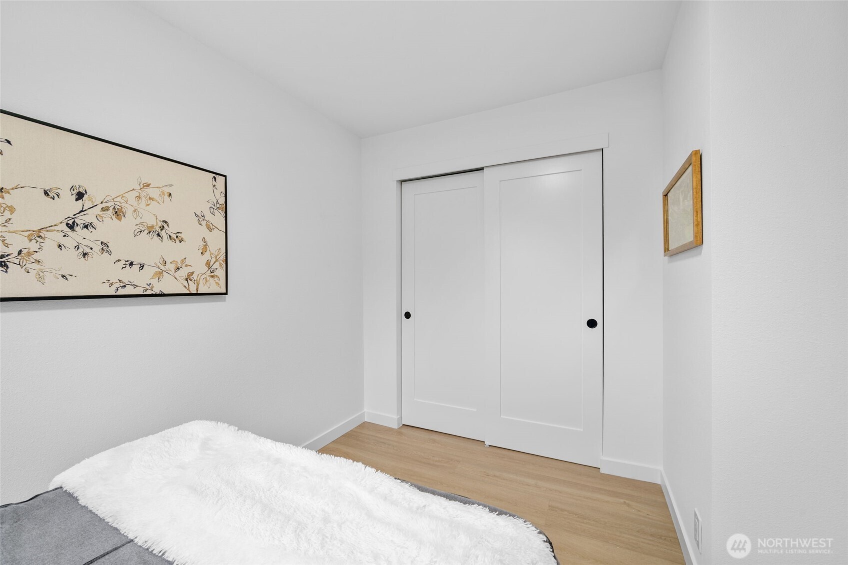 7004 16th Avenue Southwest Seattle, WA 98106 - Photo 22 of 37 a bedroom with a bed and wall painting