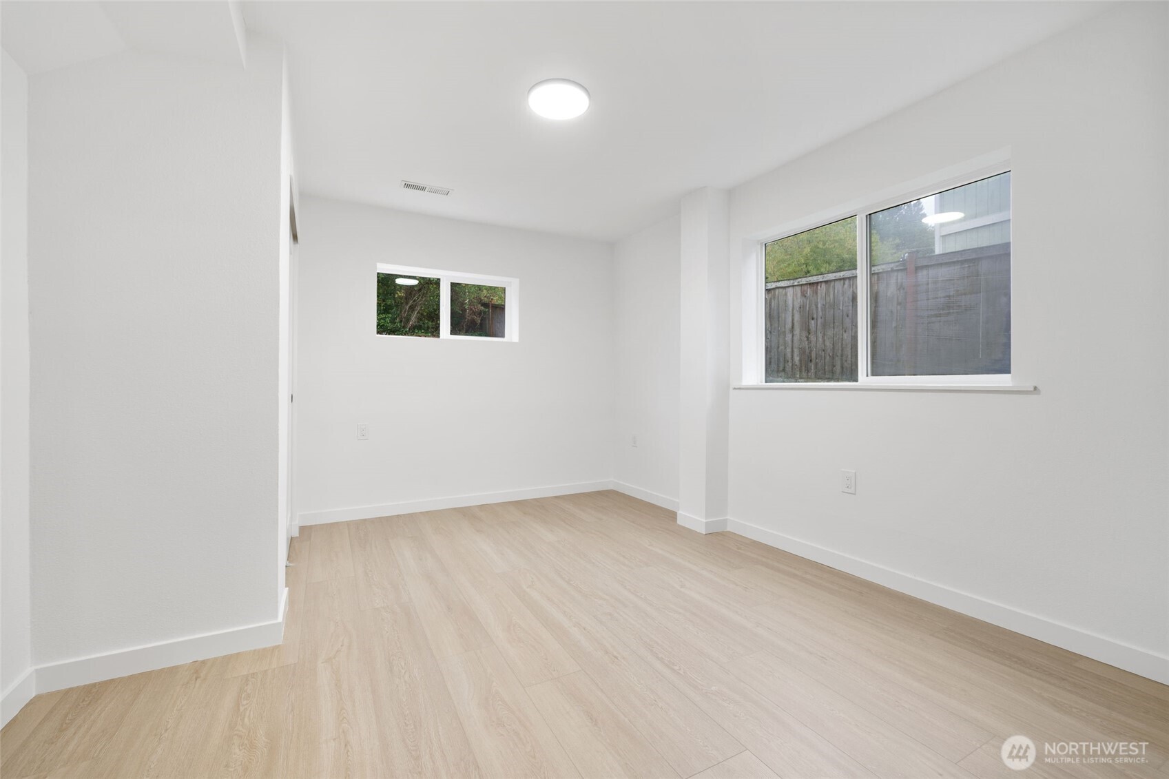 7004 16th Avenue Southwest Seattle, WA 98106 - Photo 25 of 37 an empty room with windows