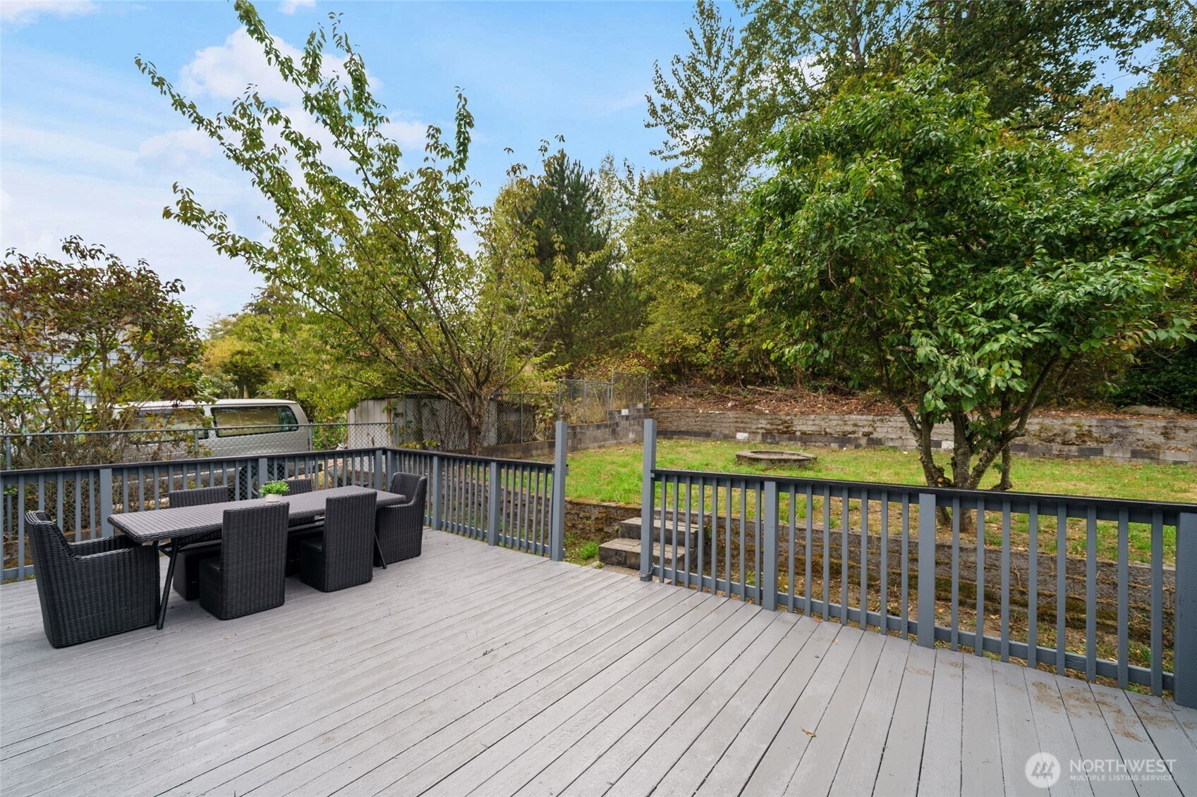 7004 16th Avenue Southwest Seattle, WA 98106 - Photo 30 of 37 a view of a deck with flat screen tv and couches