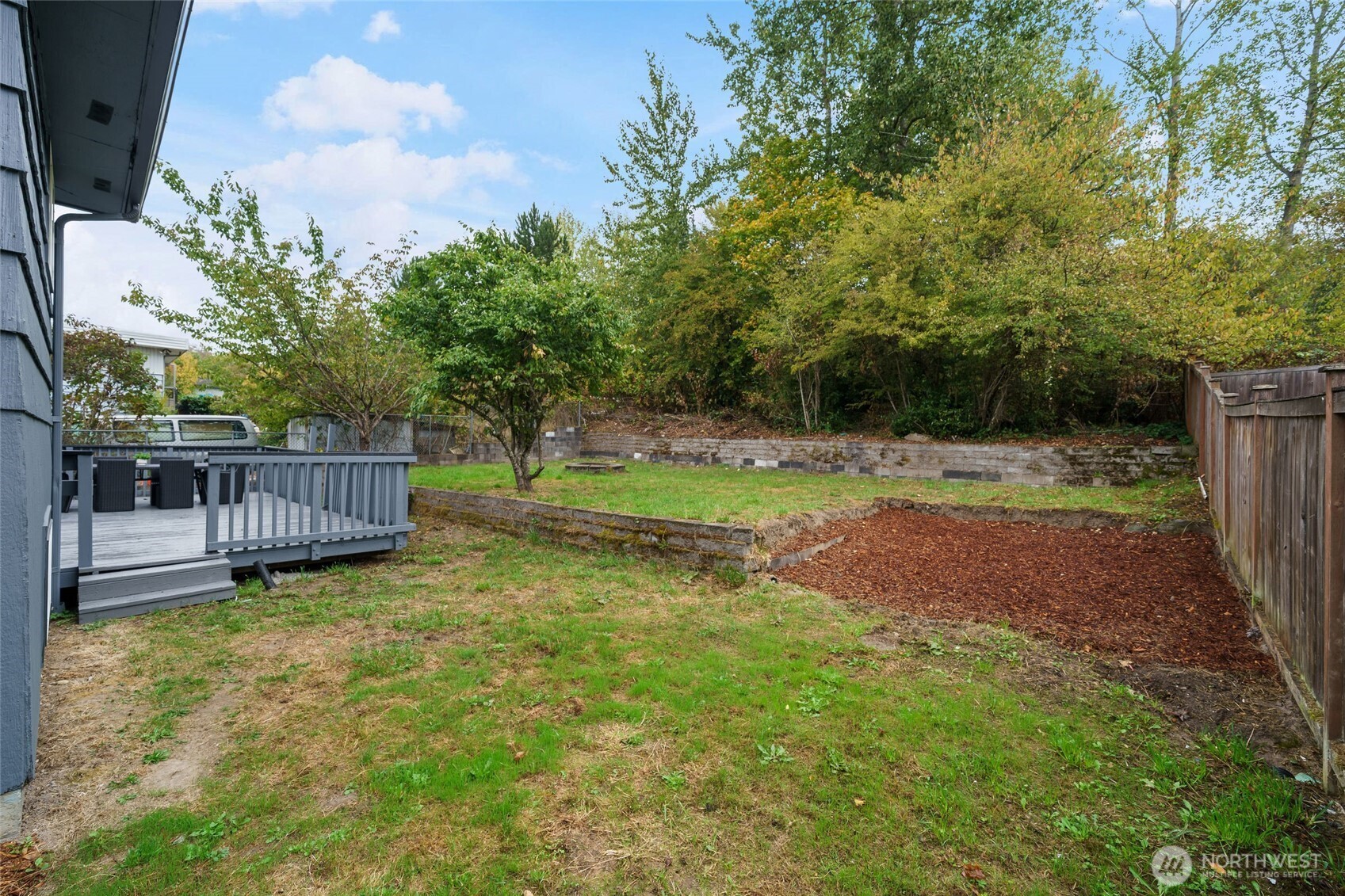7004 16th Avenue Southwest Seattle, WA 98106 - Photo 36 of 37 a view of a yard with wooden fence