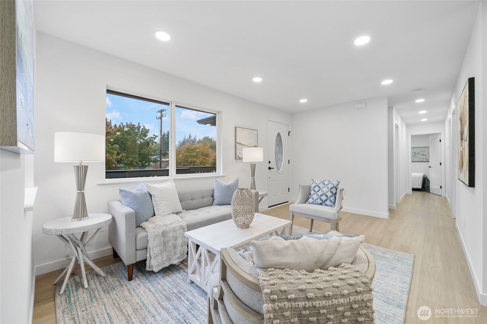 7004 16th Avenue Southwest Seattle, WA 98106 - Photo 8 of 37 a living room with furniture and a large window