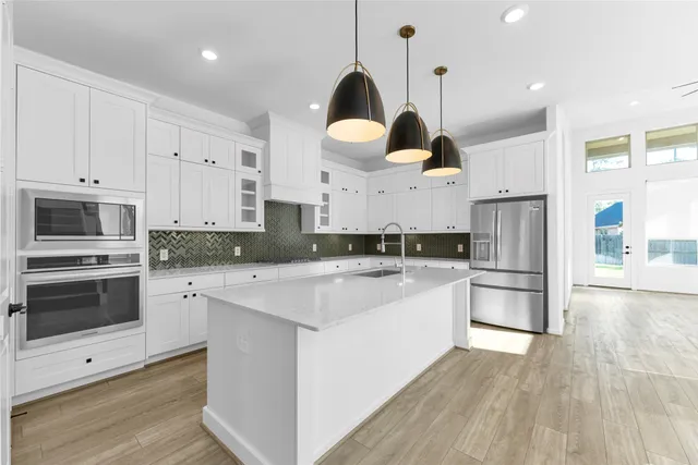 a view of a hallway with windows and stairs