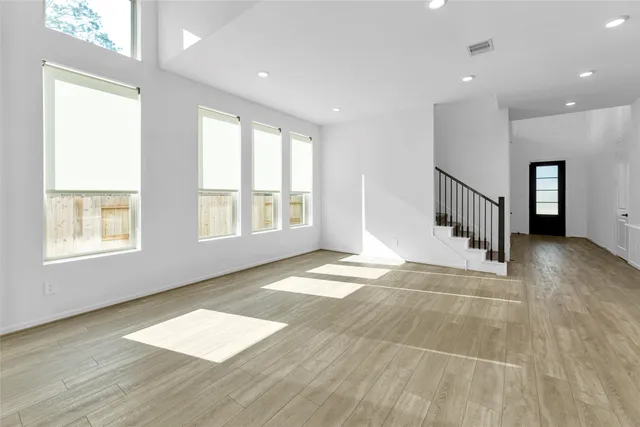 a bathroom with a shower and a glass door
